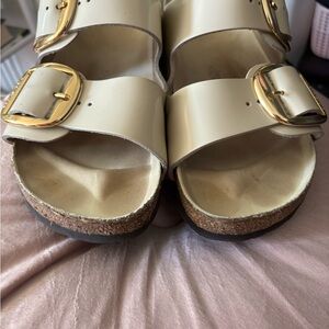 Women's Birkenstock Cream Sandals with Gold Buckles